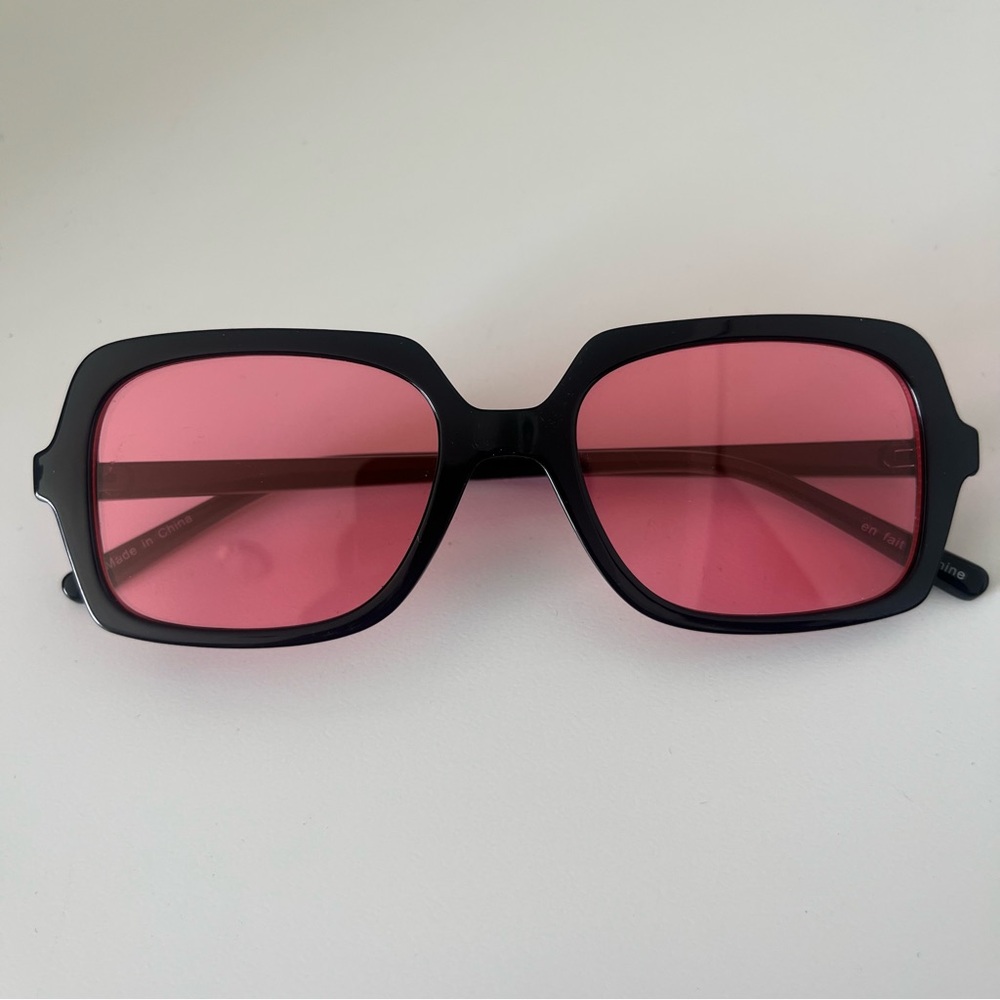 Black Frame Sunglasses with Pink Lenses from Urban Outfitters